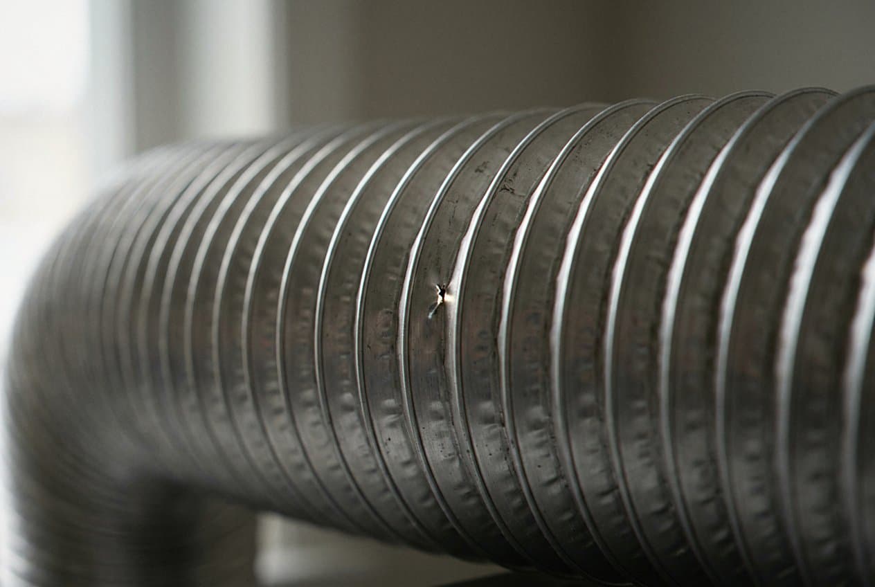 Close-up of a punctured foil duct wall